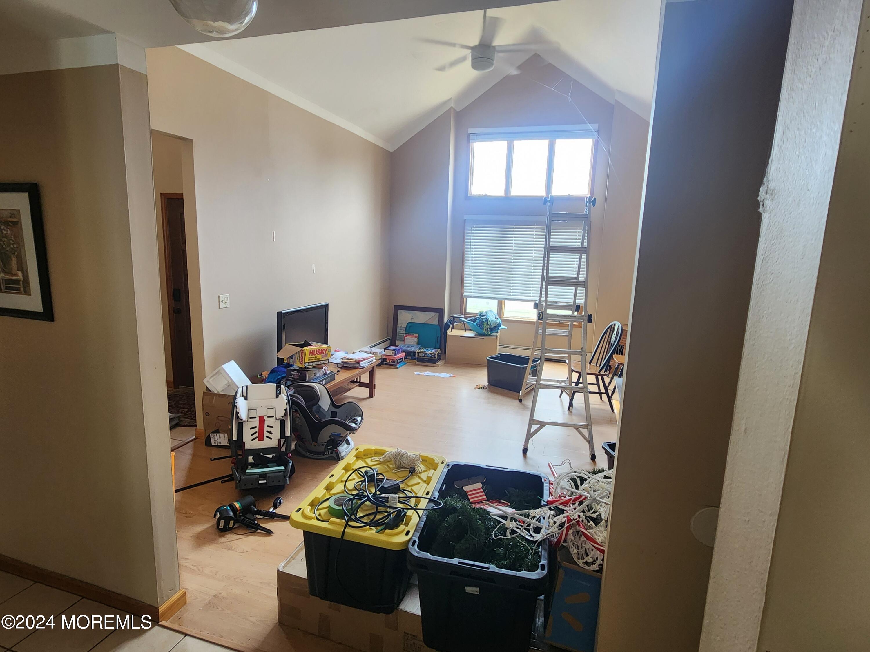 1850 Lakeside Drive South Forked River, NJ 08731 - Photo 39 of 54 a view of a workspace with a window and couch