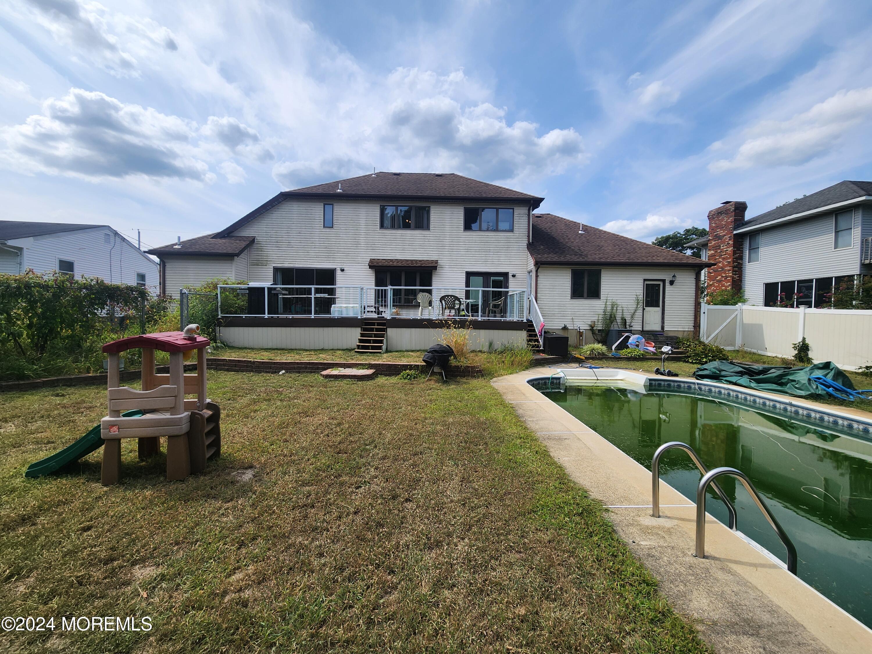 1850 Lakeside Drive South Forked River, NJ 08731 - Photo 46 of 54 a swimming pool view with a seating space and a garden view