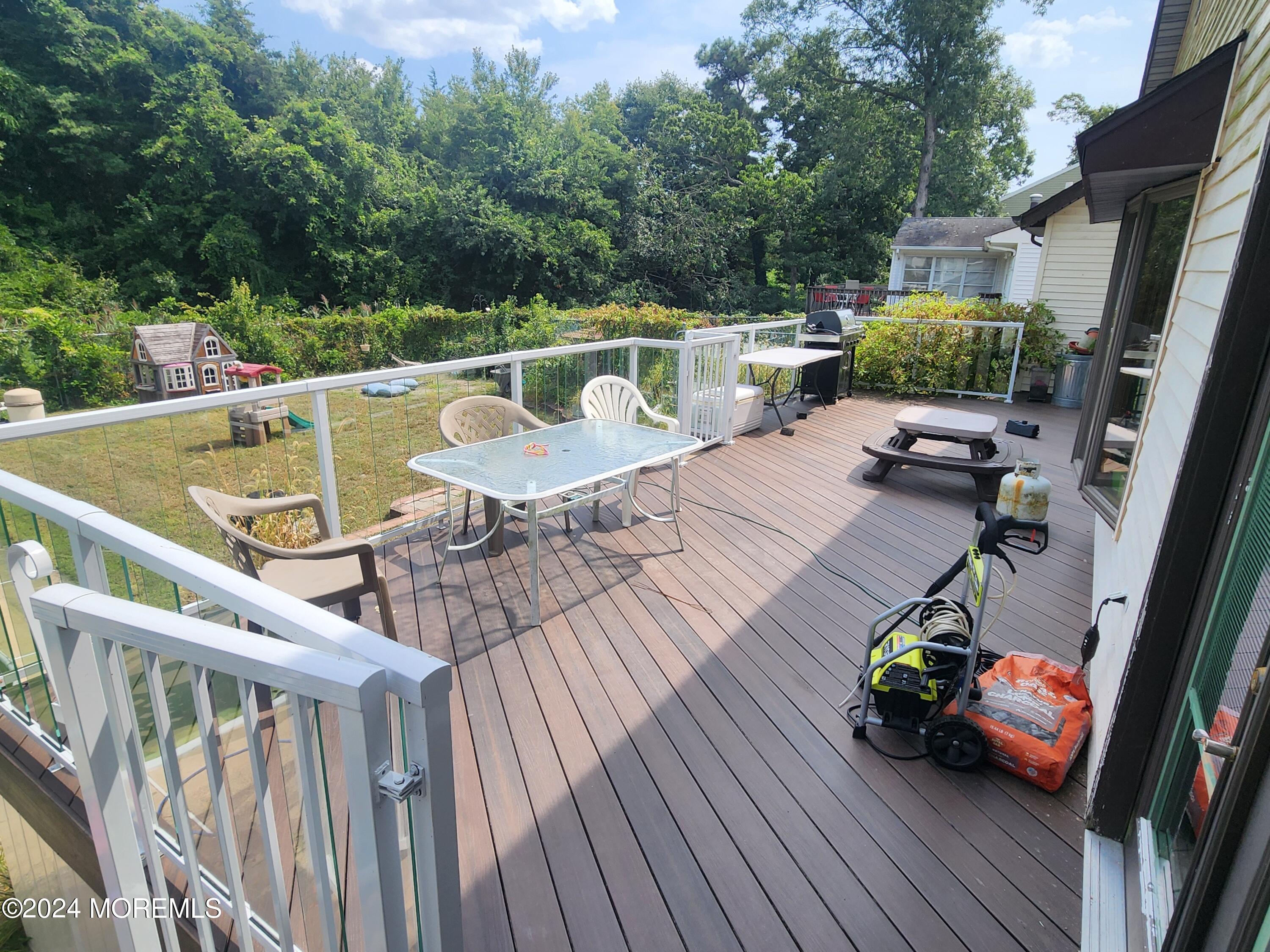 1850 Lakeside Drive South Forked River, NJ 08731 - Photo 49 of 54 a view of deck with furniture and trees