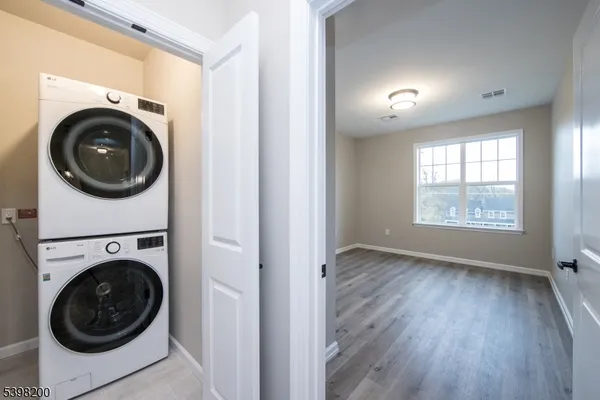 a view of a hallway with washer and dryer