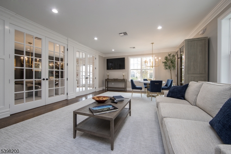 2435 Lamington Road, Unit 18 Bedminster, NJ 07921 - Photo 5 of 13 a living room with furniture window and a wooden floor