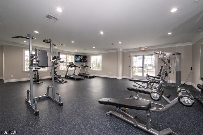 2435 Lamington Road, Unit 18 Bedminster, NJ 07921 - Photo 9 of 13 a view of a room with gym equipment
