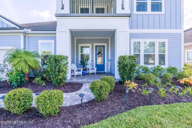 a front view of house with yard and outdoor seating