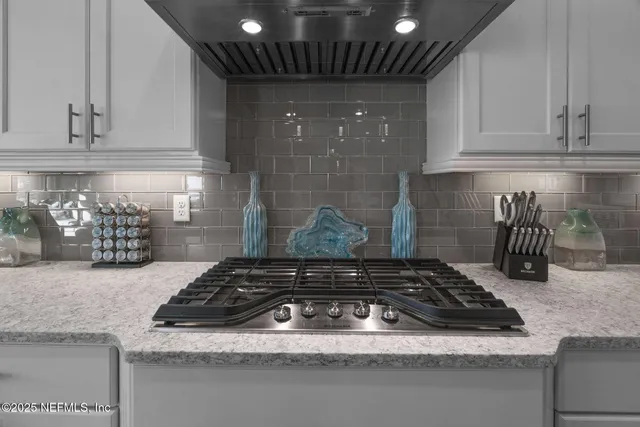 a view of a balcony with chairs and potted plants