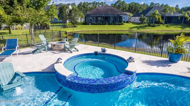 a kitchen with stainless steel appliances granite countertop a lot of counter space and wooden floor