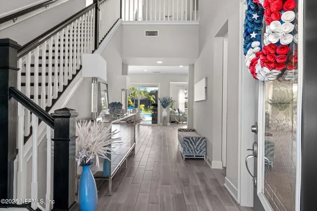 a room with furniture pool table and windows