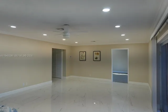 an empty room with entrance and door