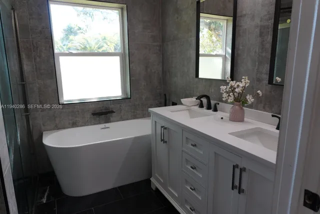 a bathroom with a sink and a bathtub