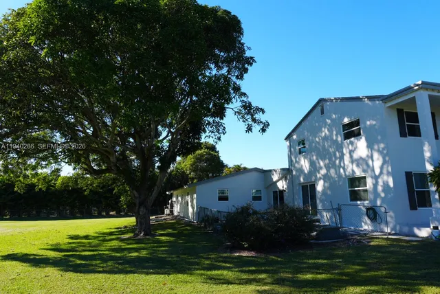 a view of a house with a big yard