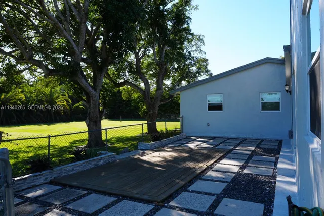 a view of a backyard with wooden floor