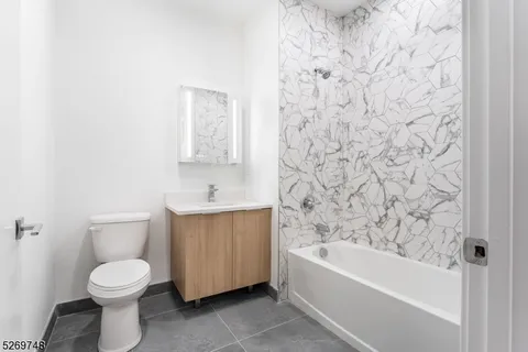 a front view of a building with parking space