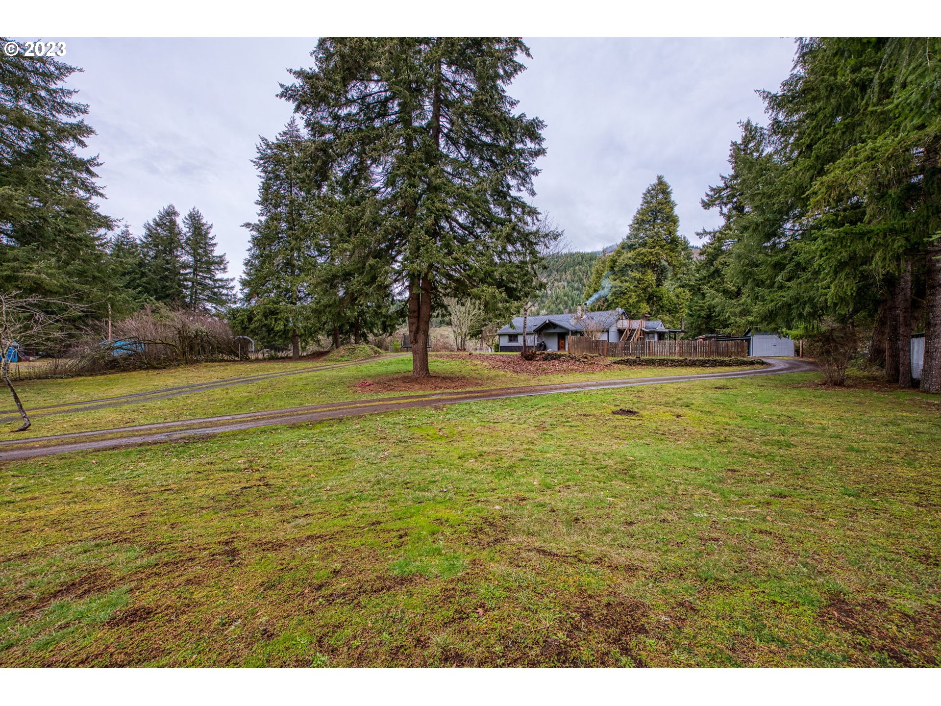 38211 Row River Road Dorena, OR 97434 - Photo 24 of 32 a view of a swimming pool with an outdoor space and seating area