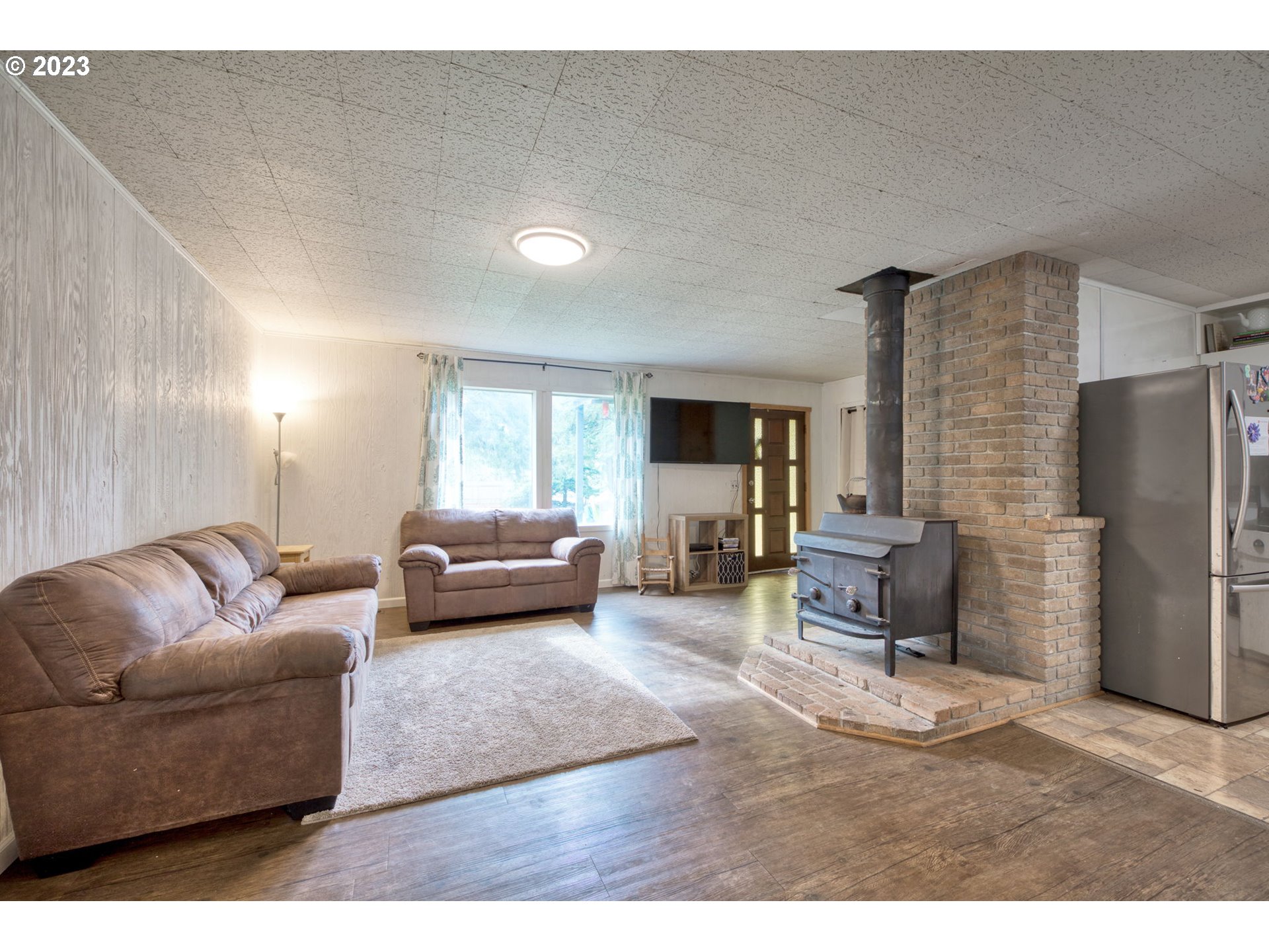 38211 Row River Road Dorena, OR 97434 - Photo 6 of 32 a living room with furniture and a couch