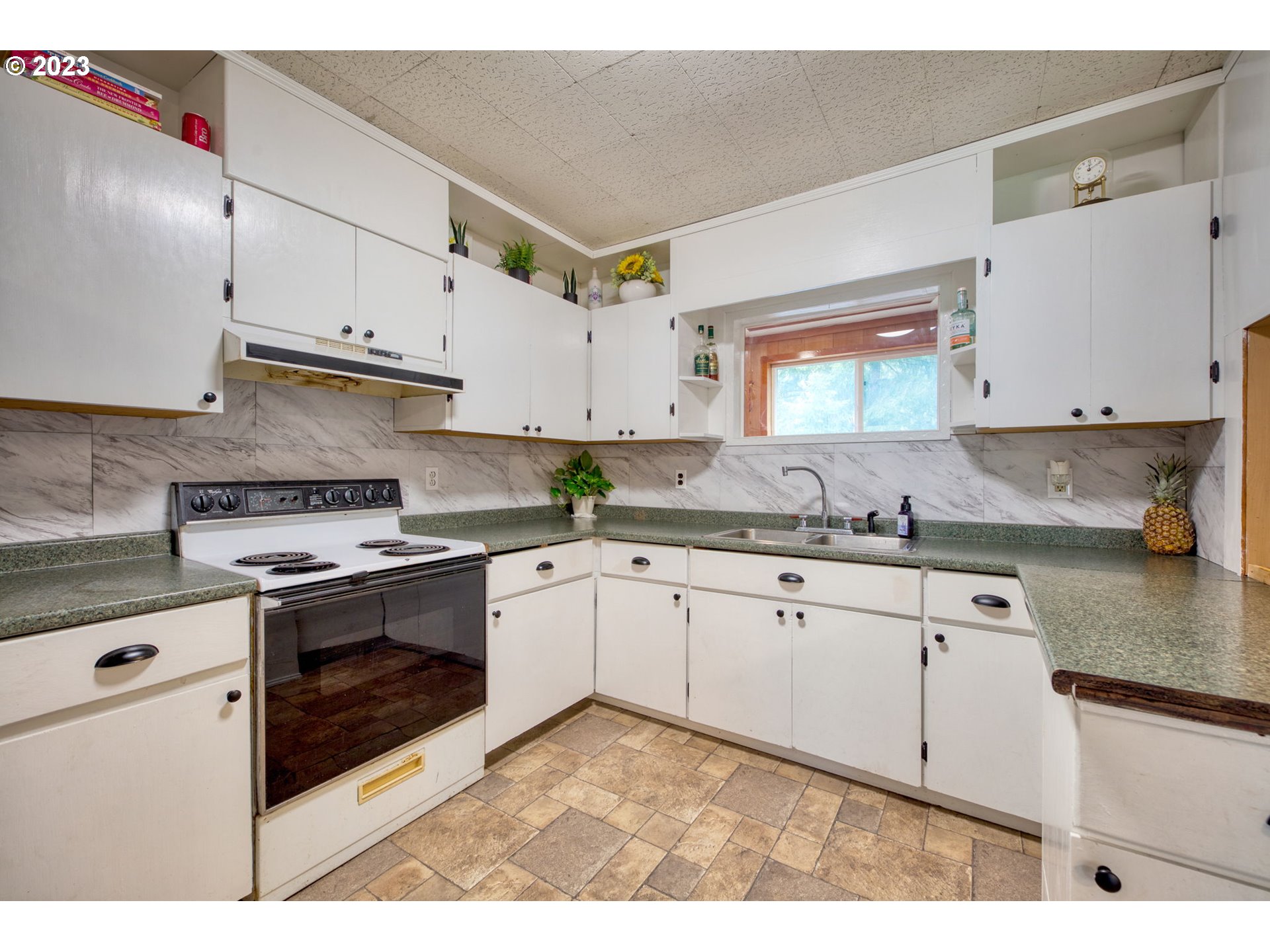 38211 Row River Road Dorena, OR 97434 - Photo 10 of 32 a kitchen with granite countertop a sink stainless steel appliances and cabinets