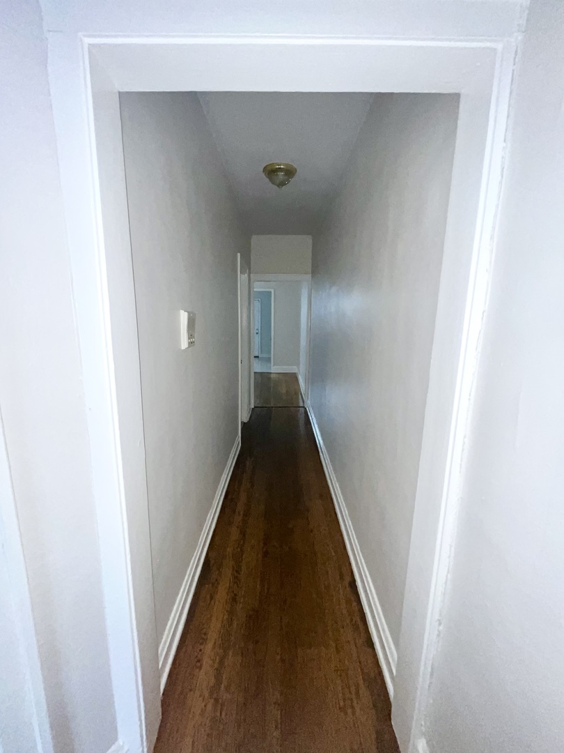 2140 North Kildare Avenue, Unit 2 Chicago, IL 60639 - Photo 7 of 11 a view of a hallway with a hallway