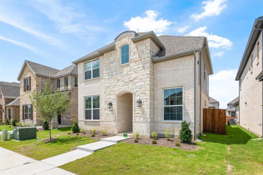 9337 Loggerhead Way Fort Worth, TX 76118 - Photo 2 of 40 a front view of a house with a yard