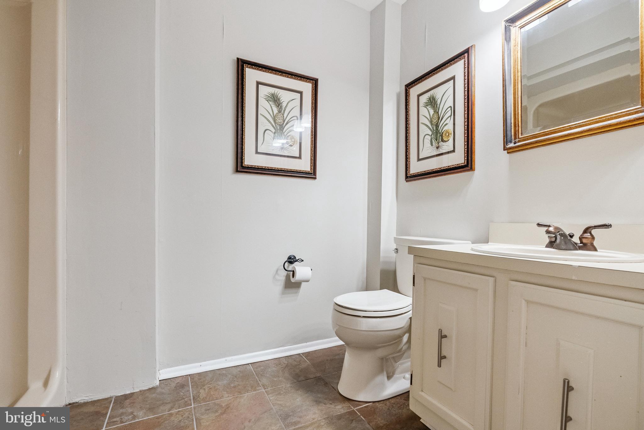 82 Farnwood Road Mount Laurel, NJ 08054 - Photo 11 of 22 a bathroom with a toilet sink and mirror