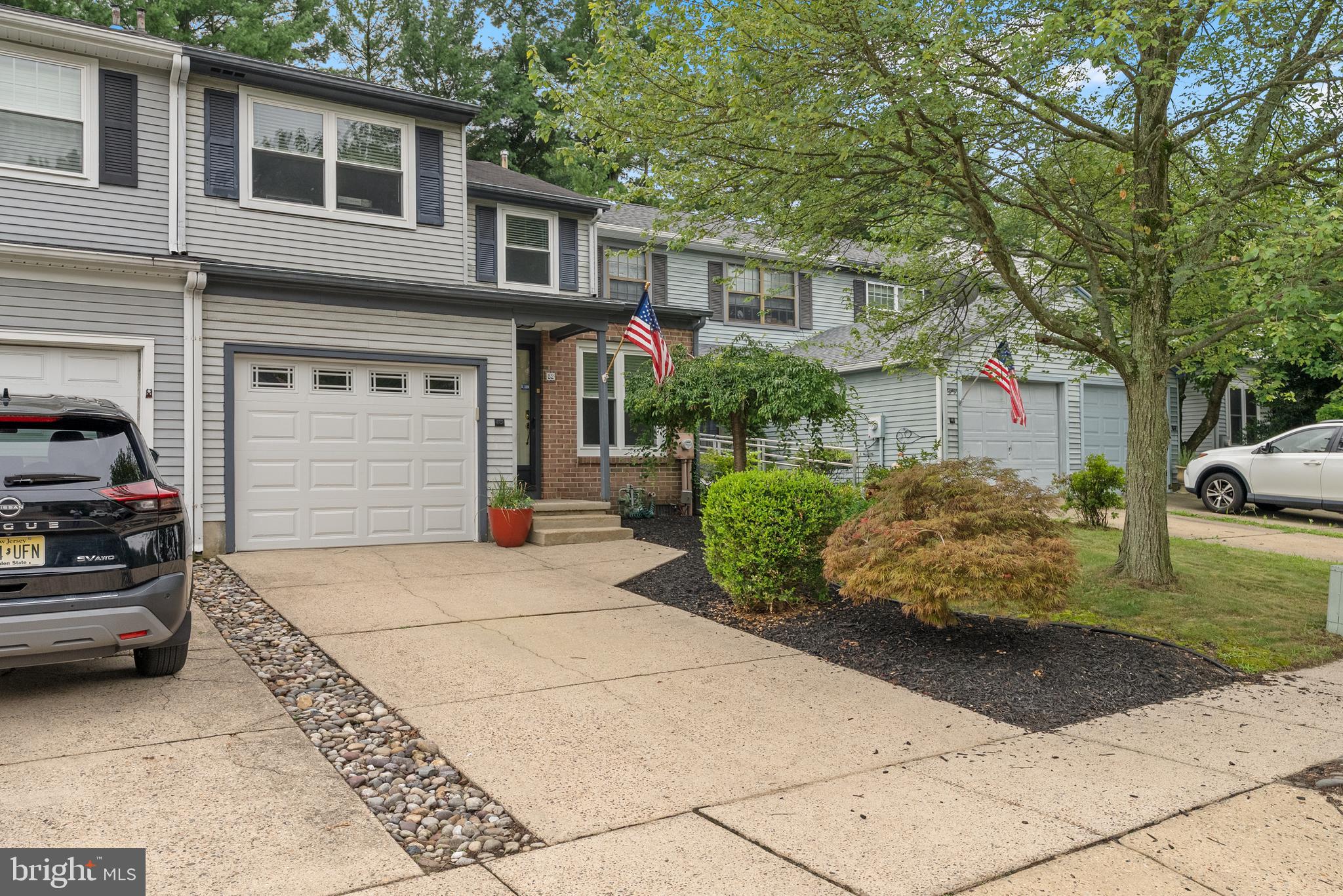 82 Farnwood Road Mount Laurel, NJ 08054 - Photo 2 of 22 a front view of a house with a garden