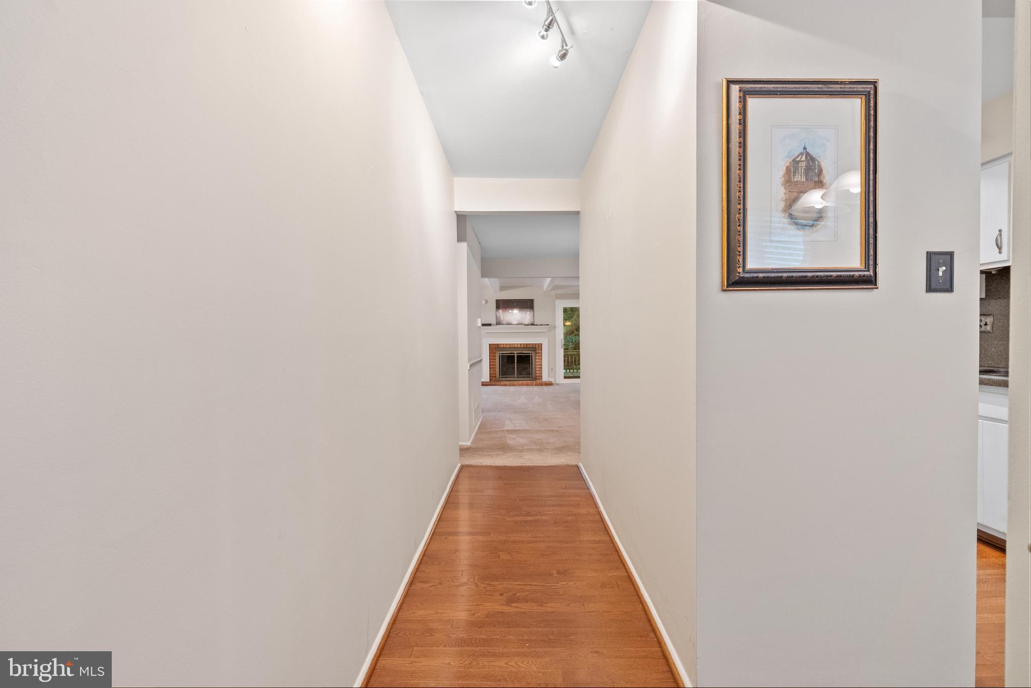 82 Farnwood Road Mount Laurel, NJ 08054 - Photo 3 of 22 a hallway with wooden floor and a bathroom