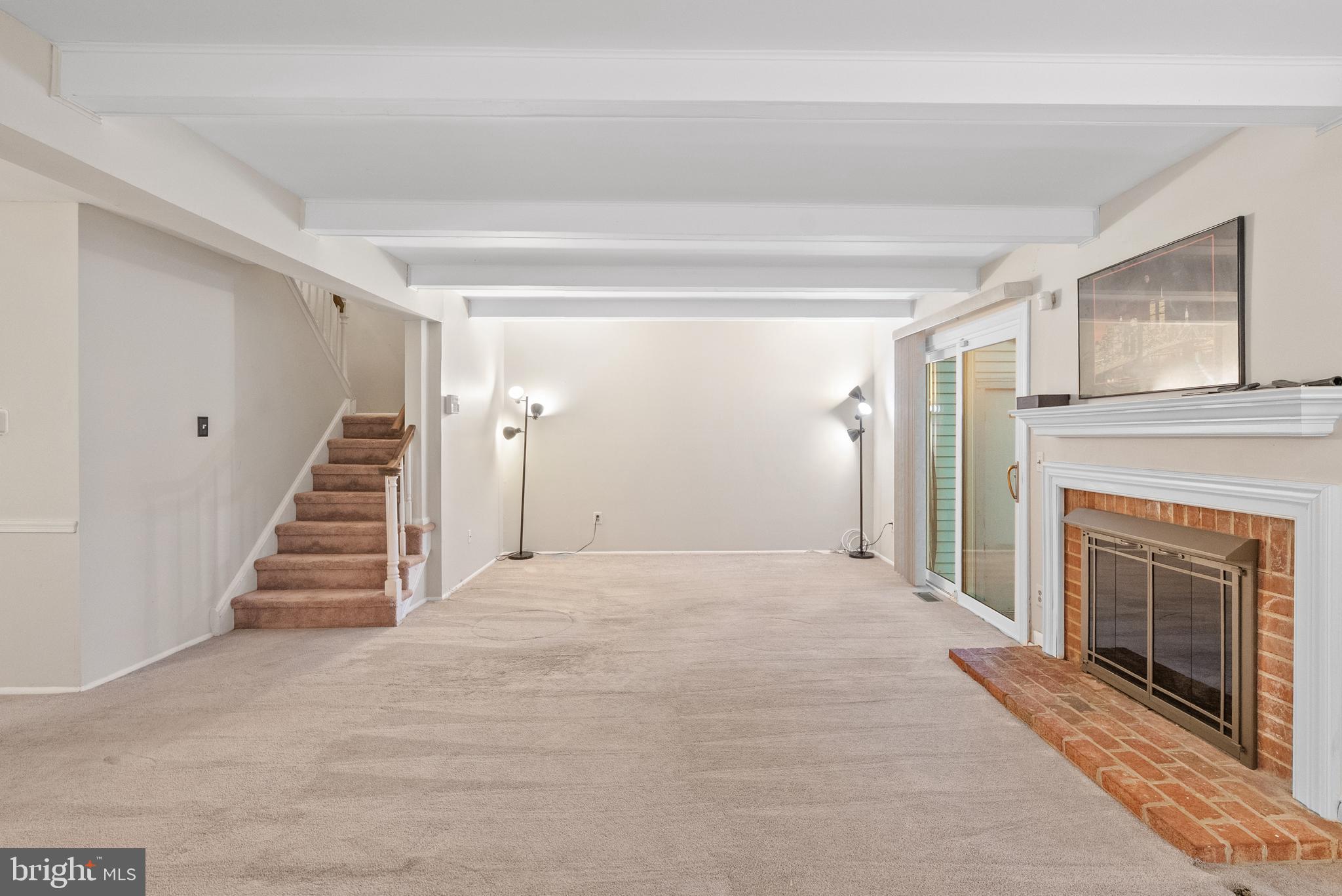 82 Farnwood Road Mount Laurel, NJ 08054 - Photo 6 of 22 a view of empty room with stairs and fireplace