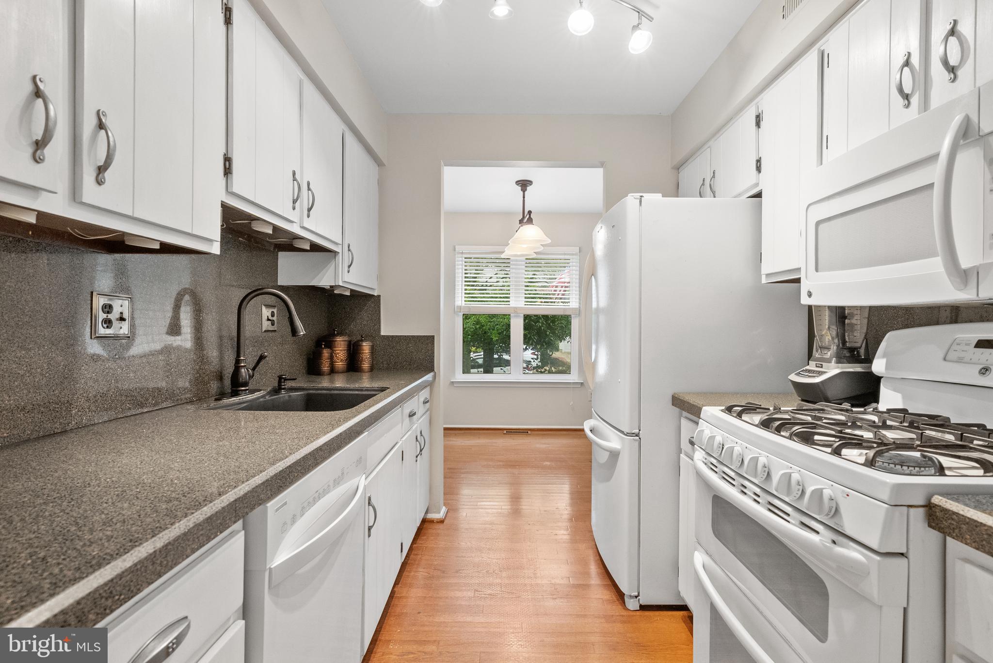 82 Farnwood Road Mount Laurel, NJ 08054 - Photo 9 of 22 a kitchen with stainless steel appliances granite countertop a sink stove and refrigerator