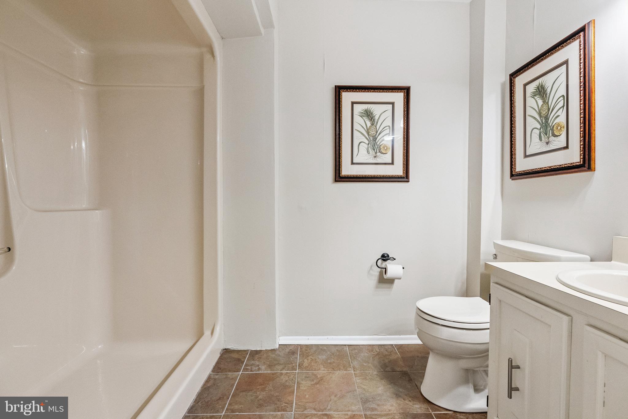 82 Farnwood Road Mount Laurel, NJ 08054 - Photo 10 of 22 a white toilet sitting next to a shower curtain