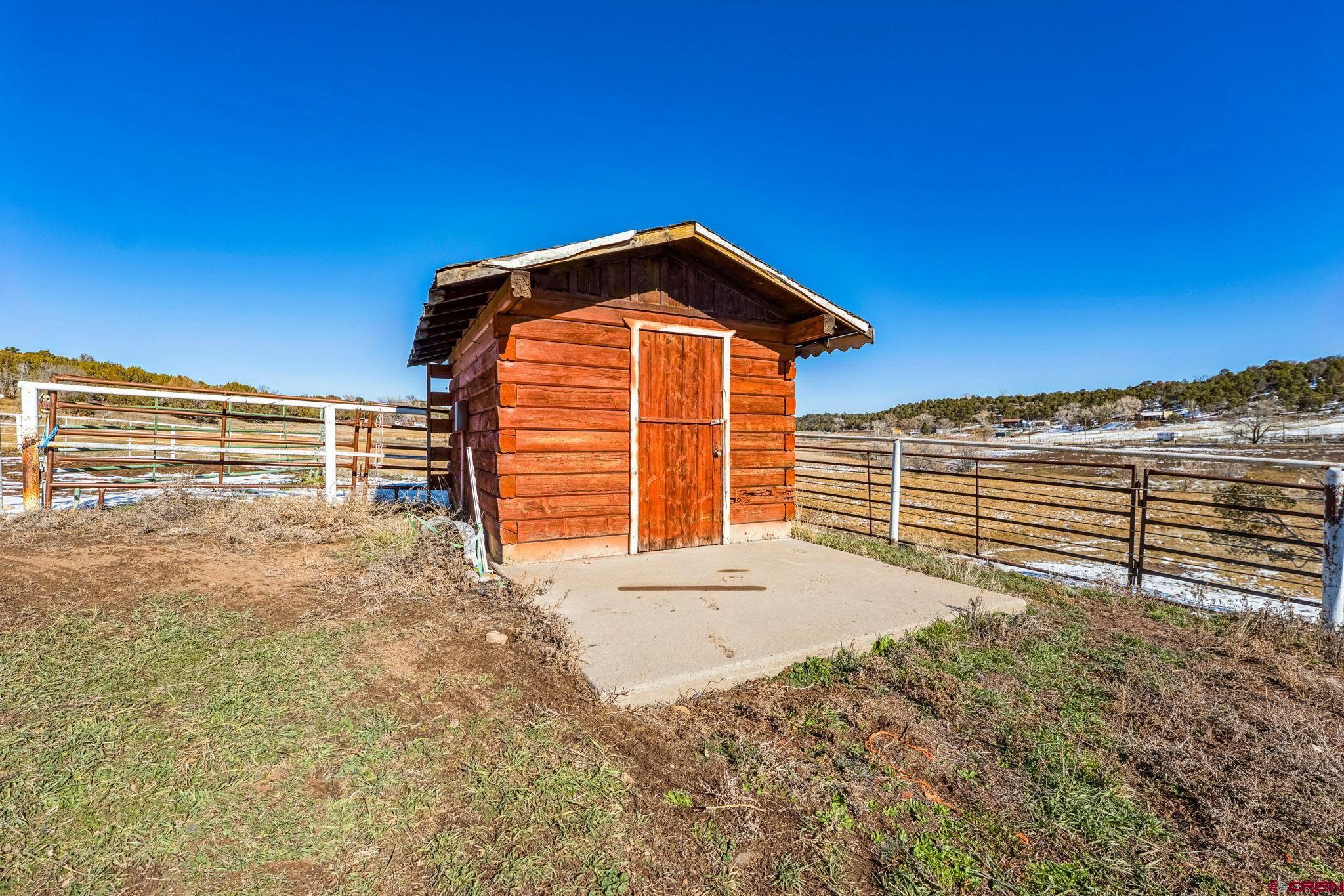 124 Meadow Road Ignacio, CO 81137 - Photo 17 of 37 a view of a house with a backyard