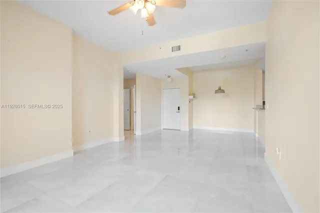 a view of a kitchen with a sink and a refrigerator