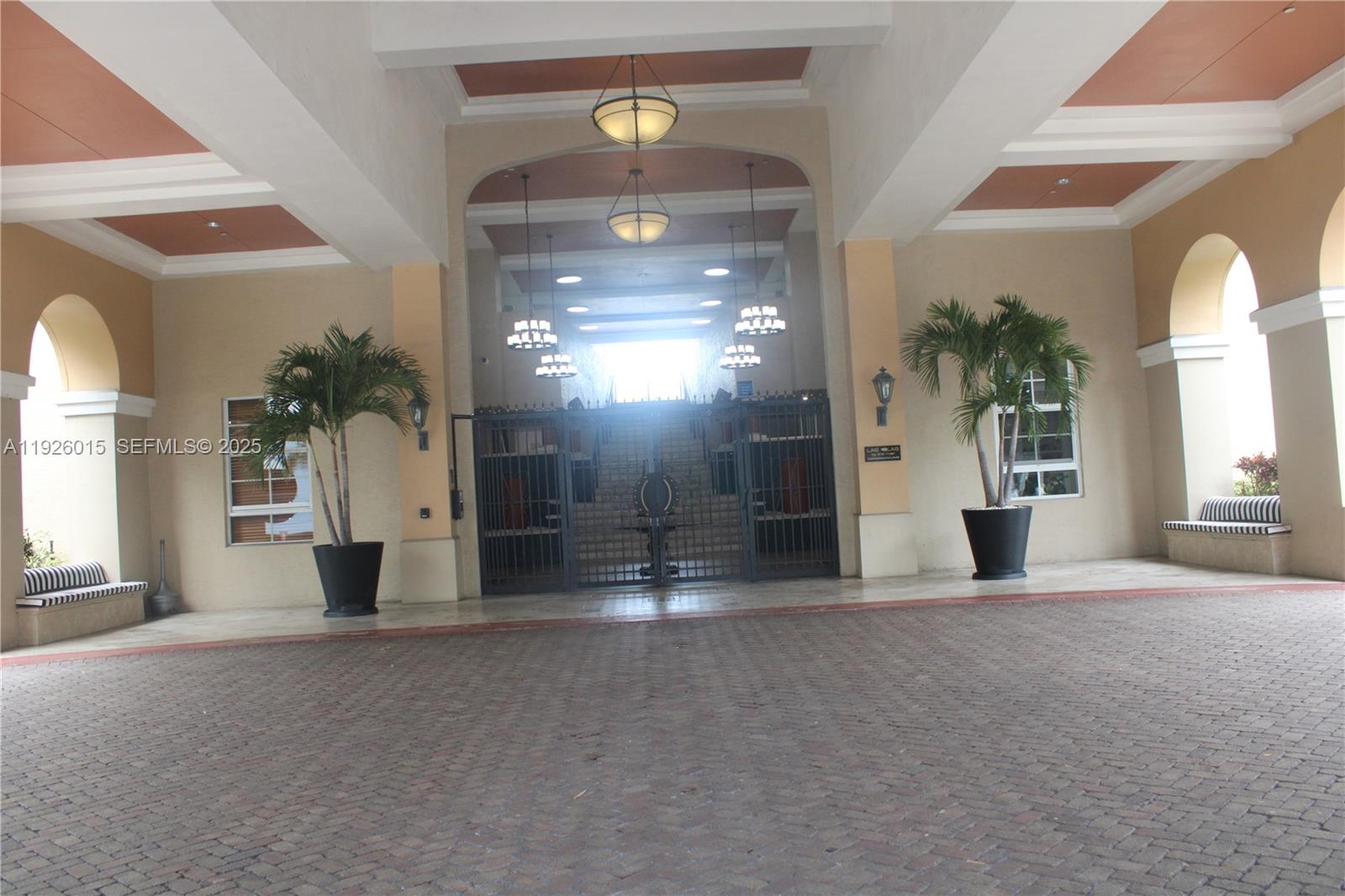 520 Southeast 5th Avenue, Unit 1109 Fort Lauderdale, FL 33301 - Photo 2 of 39 a view of a big room with windows and chandelier