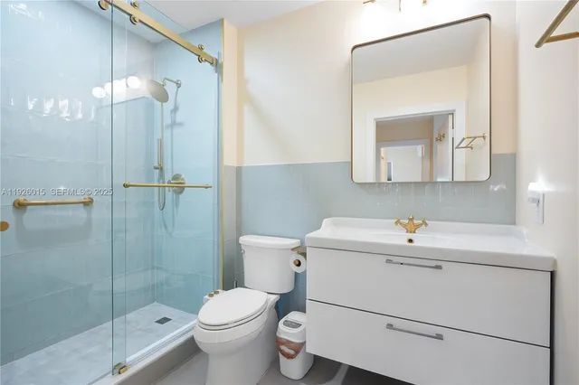 a view of a bathroom from a corridor