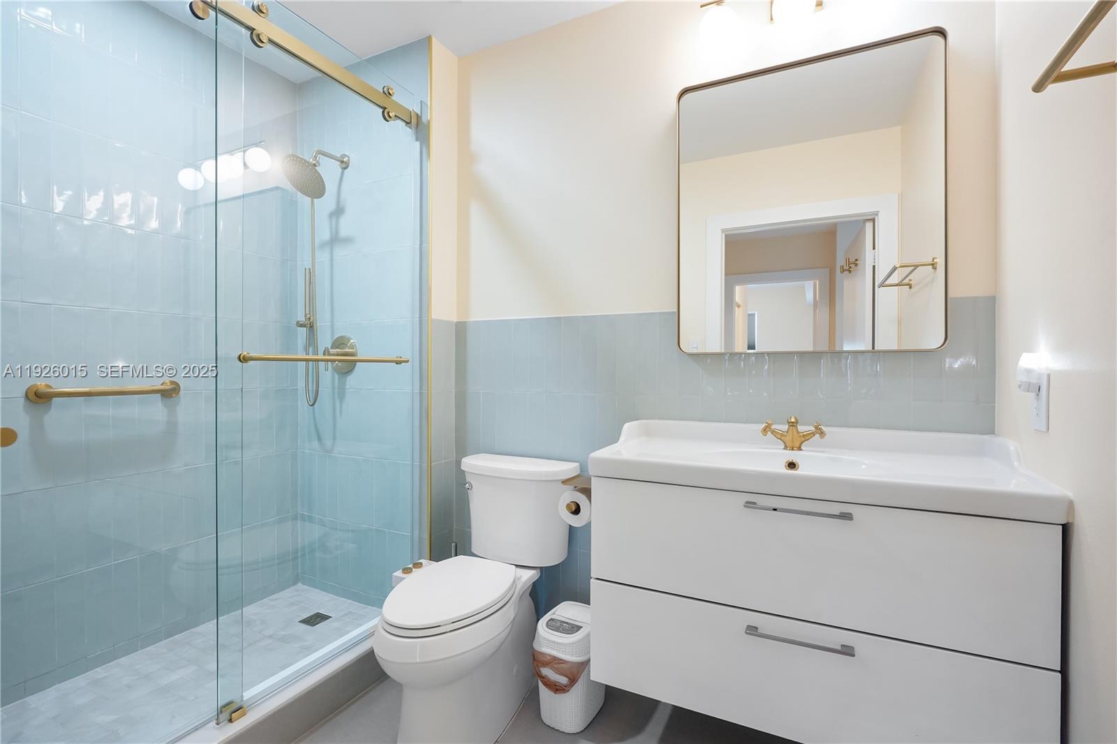 520 Southeast 5th Avenue, Unit 1109 Fort Lauderdale, FL 33301 - Photo 21 of 39 a bathroom with a sink toilet and shower