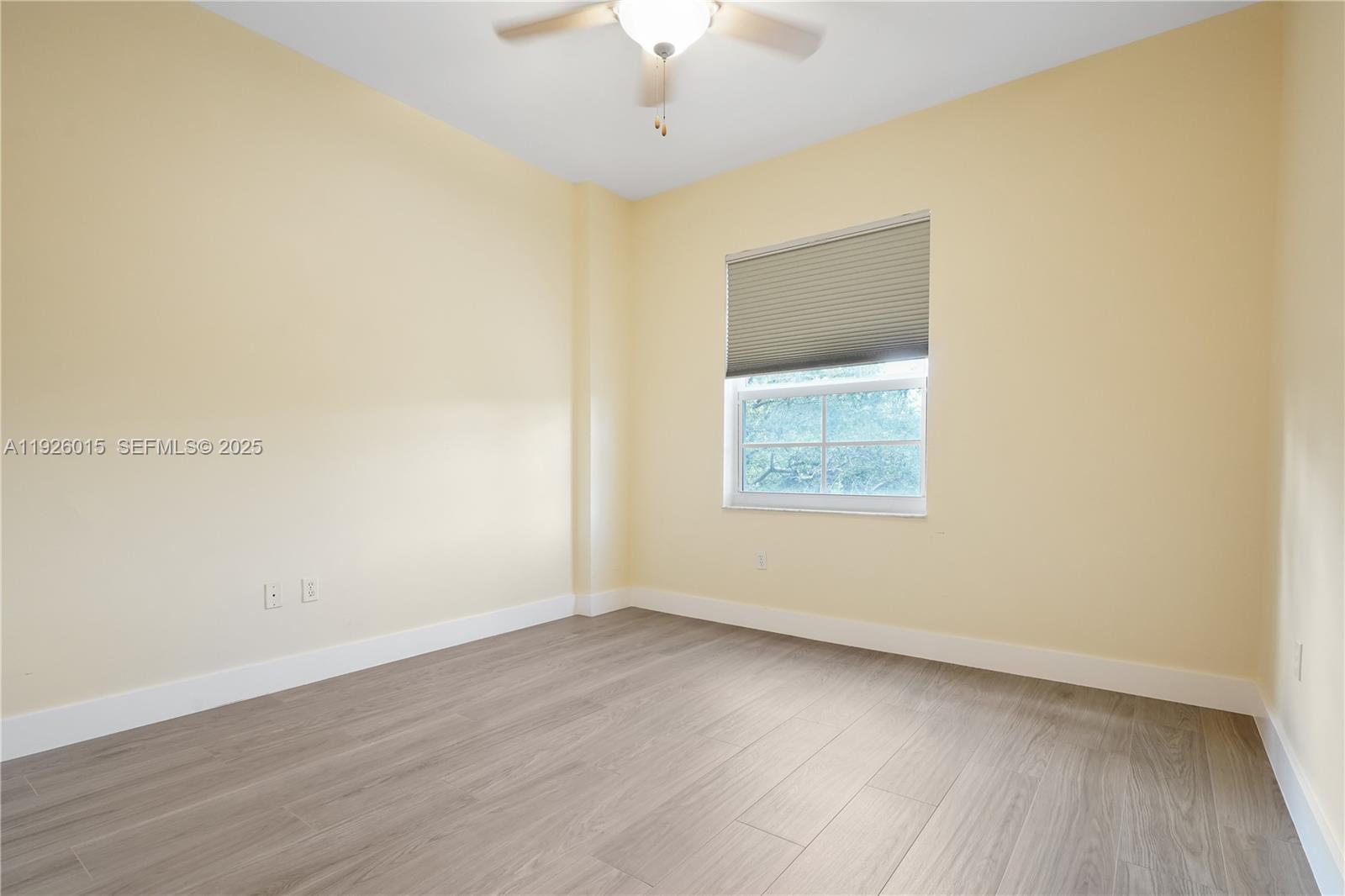 520 Southeast 5th Avenue, Unit 1109 Fort Lauderdale, FL 33301 - Photo 26 of 39 a view of an empty room with wooden floor and a window