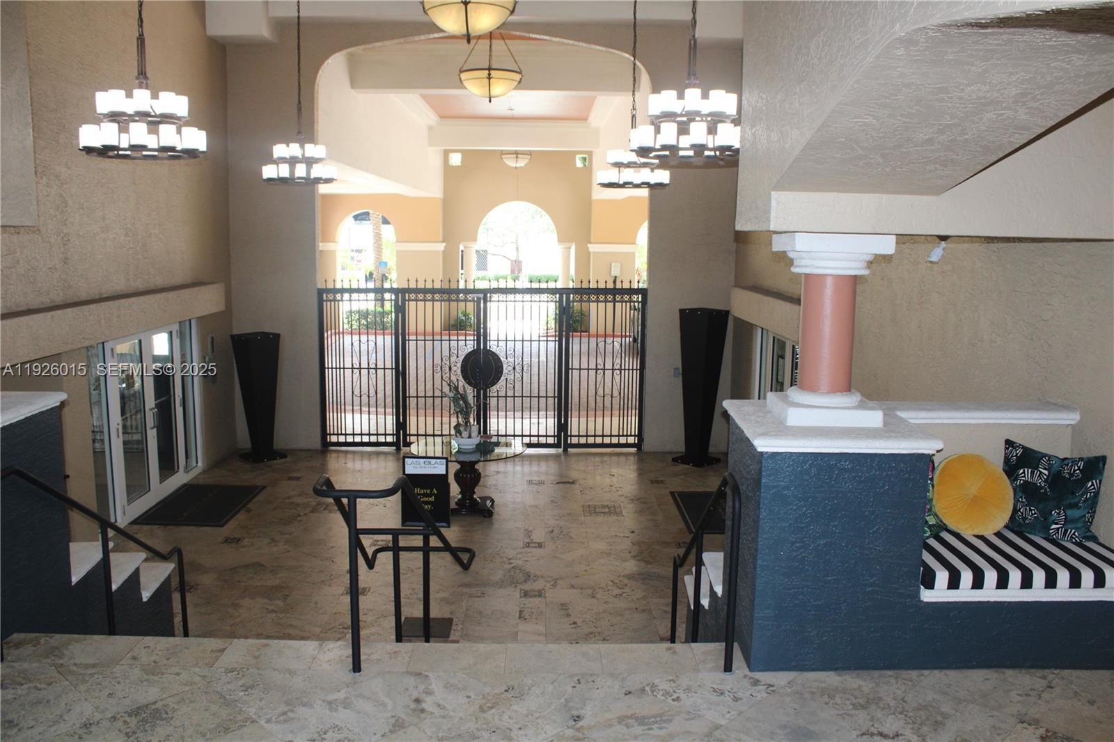 520 Southeast 5th Avenue, Unit 1109 Fort Lauderdale, FL 33301 - Photo 35 of 39 a view of a dining room with furniture chandelier and wooden floor