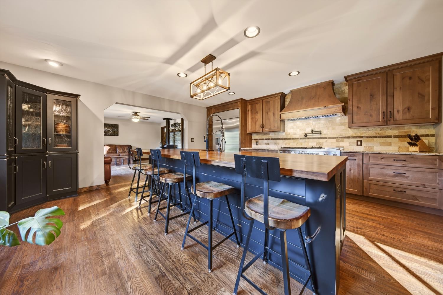 11234 Valencia Road Nevada City, CA 95959 - Photo 12 of 62 a view of a dining room with furniture kitchen and wooden floor