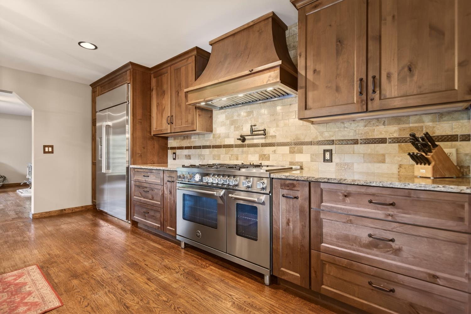 11234 Valencia Road Nevada City, CA 95959 - Photo 13 of 62 a kitchen with stainless steel appliances granite countertop a stove and a refrigerator