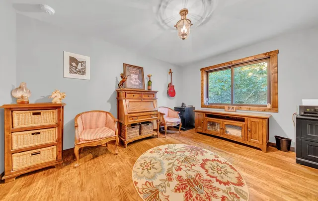 a bedroom with furniture and a window