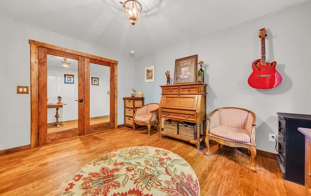 a bedroom with furniture and window