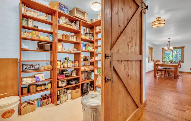 a view of a entryway with furniture and wooden floor