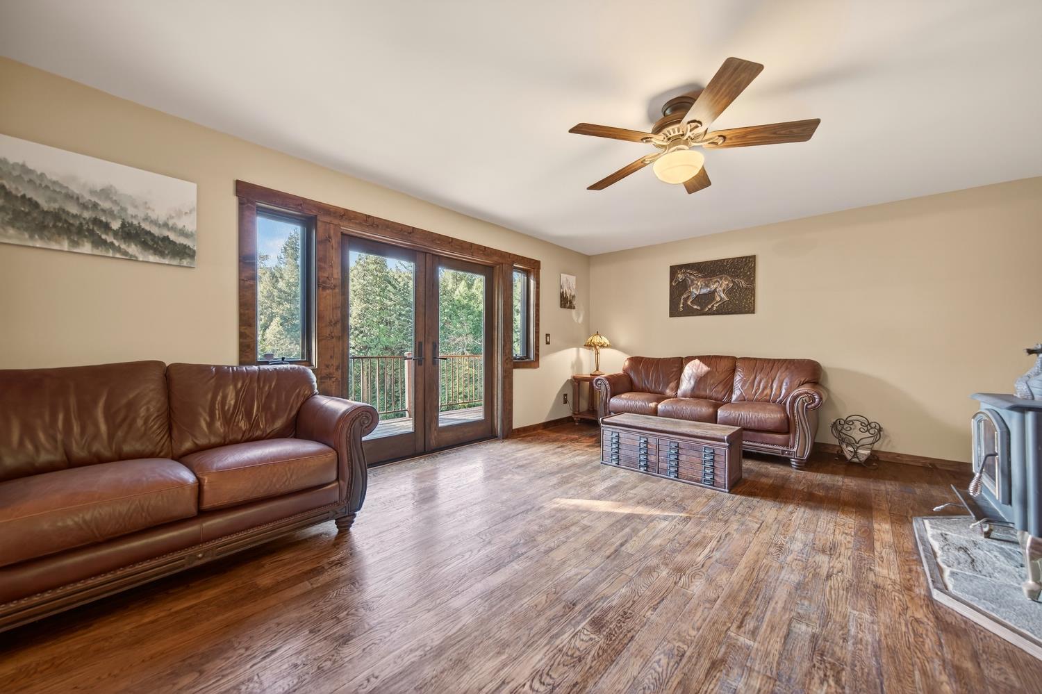 11234 Valencia Road Nevada City, CA 95959 - Photo 15 of 62 a living room with furniture and a large window