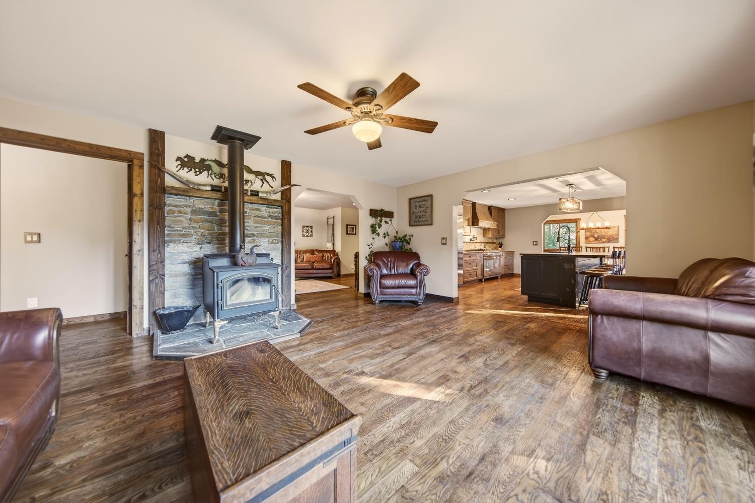 11234 Valencia Road Nevada City, CA 95959 - Photo 16 of 62 a living room with furniture and a fireplace