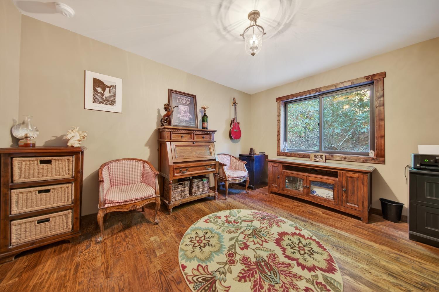 11234 Valencia Road Nevada City, CA 95959 - Photo 18 of 62 a living room with furniture and a wooden floor