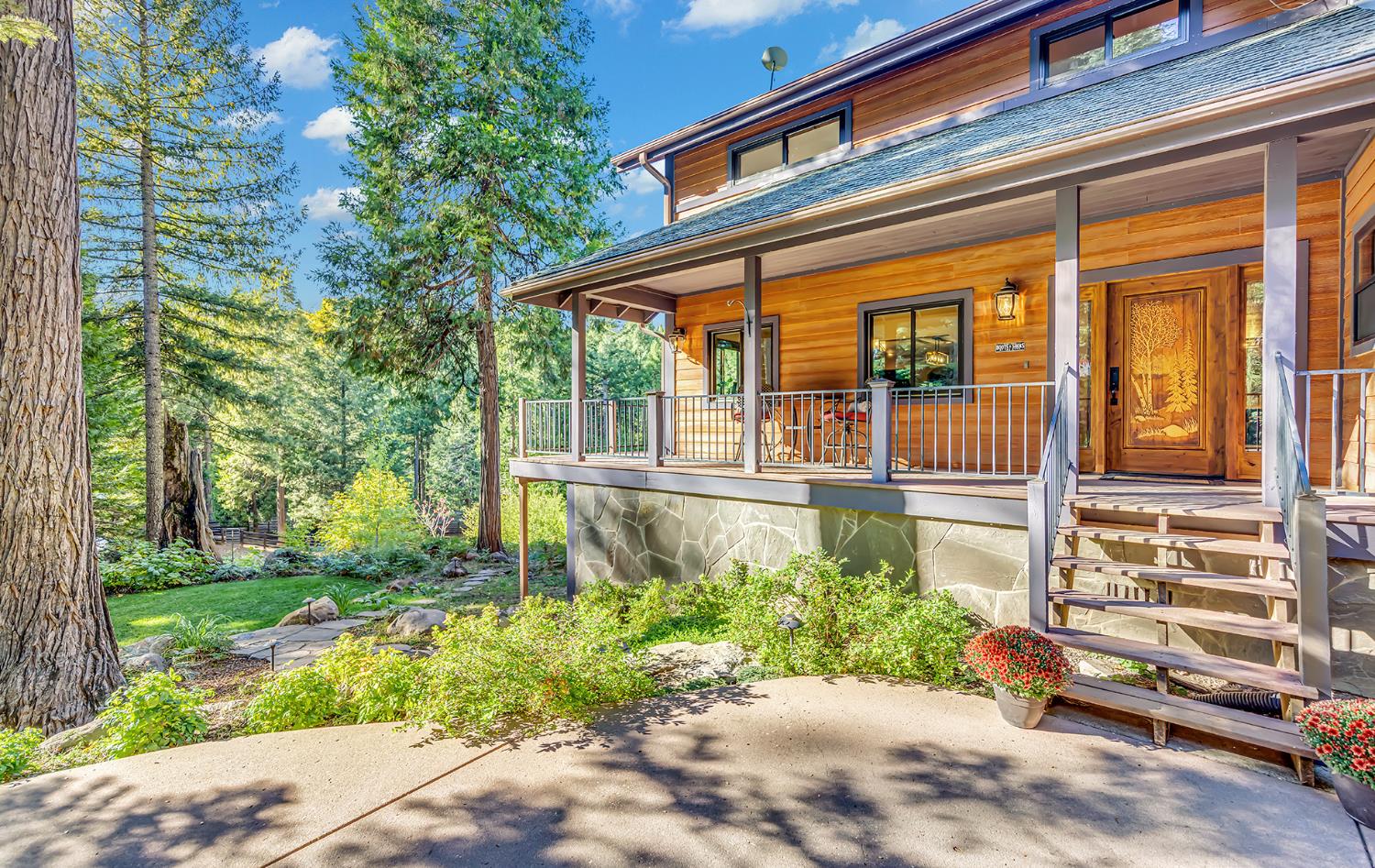 11234 Valencia Road Nevada City, CA 95959 - Photo 2 of 62 a view of a house with a yard