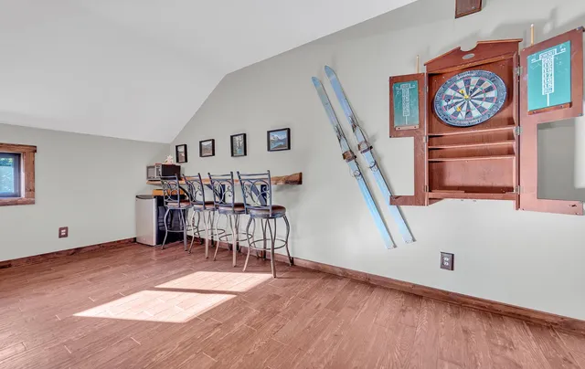 a area with furniture and wooden floor