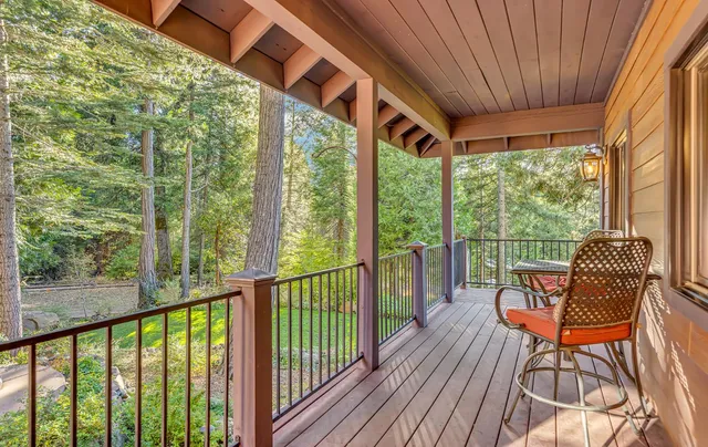 a view of a chair and table in the balcony
