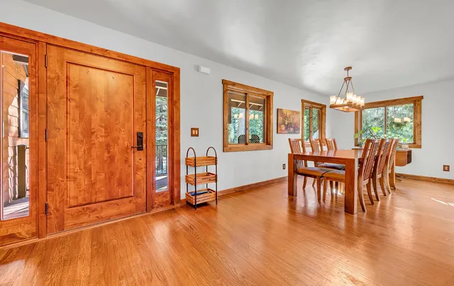 a view of a dining room with furniture window and wooden floor