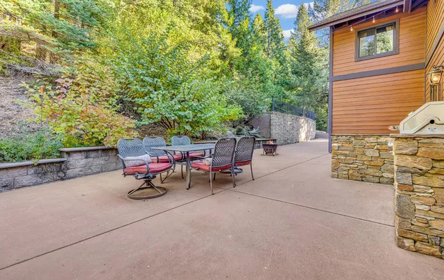 a view of a backyard with sitting area