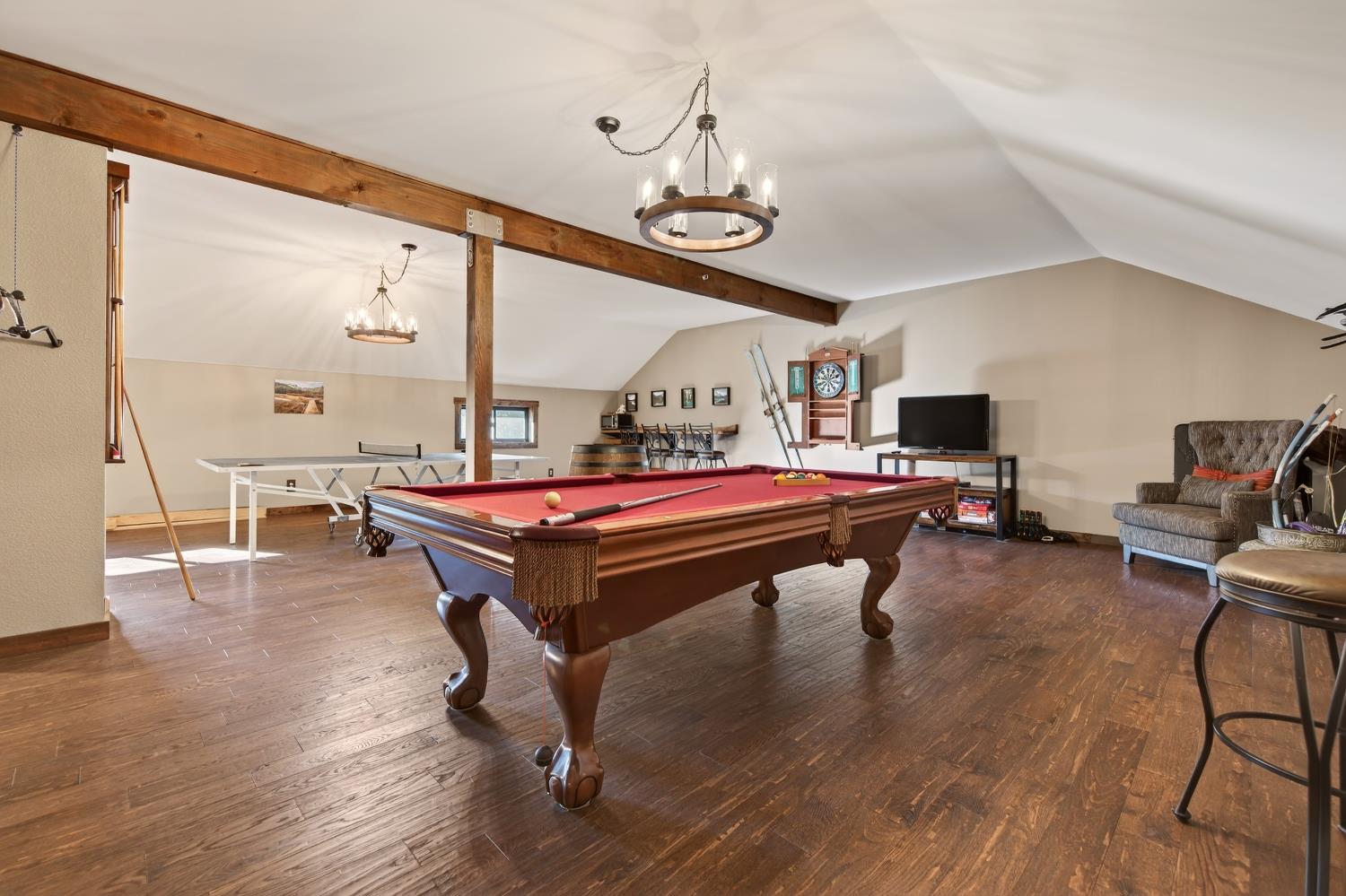 11234 Valencia Road Nevada City, CA 95959 - Photo 32 of 62 a room with pool table and wooden floor