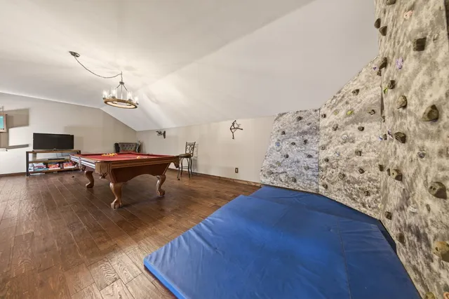 a view of a patio with table and chairs and potted plants