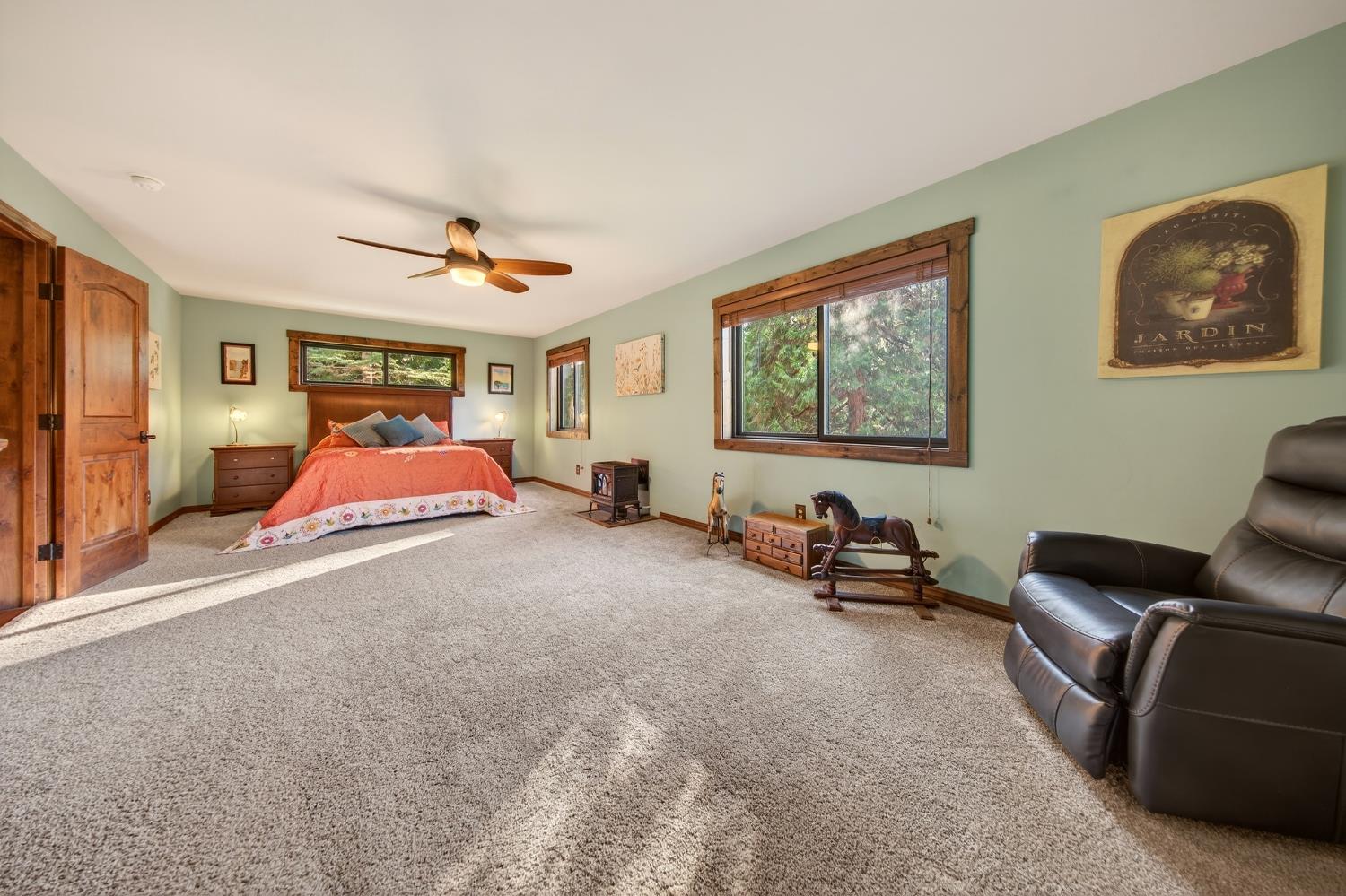 11234 Valencia Road Nevada City, CA 95959 - Photo 39 of 62 a bedroom with furniture and a large window