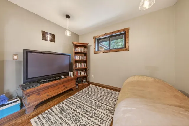 a view of a green field with lots of bushes